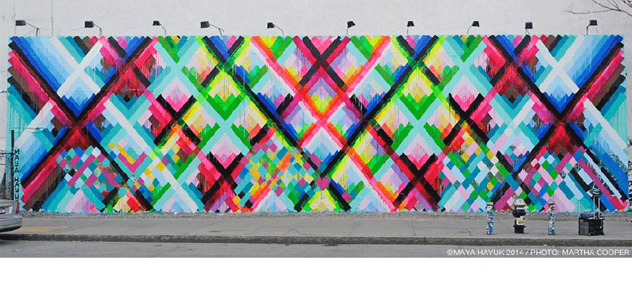 The Houston Bowery Wall — a bright geometric mural by Maya Hayuk filling the wall at East Houston Street and the Bowery